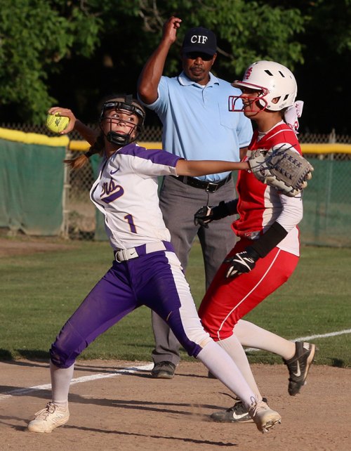 Lemoore's Kyleigh Allen throws to first after making an out at third in last week's playoff game against Santa Maria.